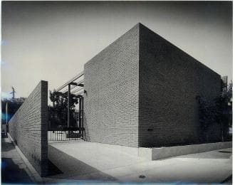 A black and white photo of an industrial building.