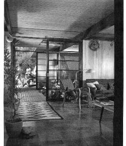 An old black and white photo of a living room.