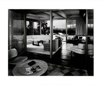 A black and white photo of a living room.