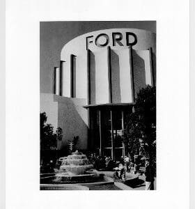 A black and white photo of the ford building.