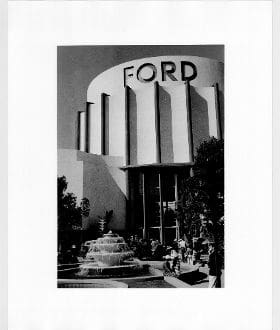 A black and white photo of the ford building.
