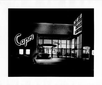 A black and white photo of the front entrance to capri.