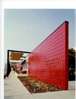 A red wall with a large sign on it