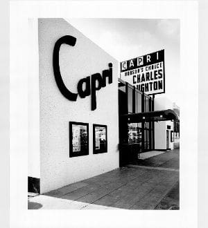 A black and white photo of the entrance to a theater.