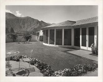 A black and white photo of an old house