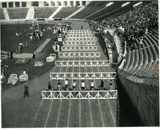 A black and white photo of an indoor track