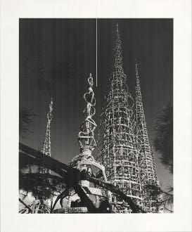 A black and white photo of the watts towers.