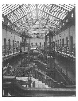 A large building with scaffolding on the ceiling.