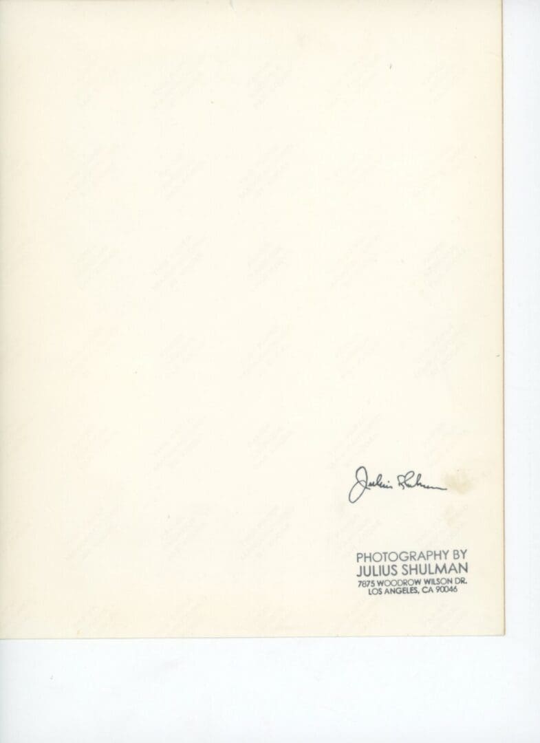 Signature and photography credits on blank background.