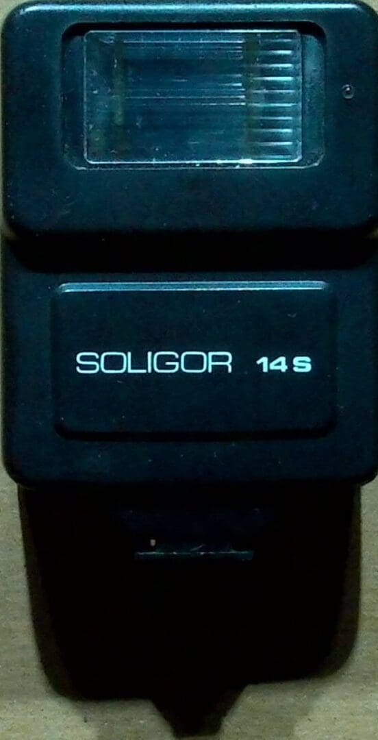 Close-up of a Soligor 14S camera flash unit.