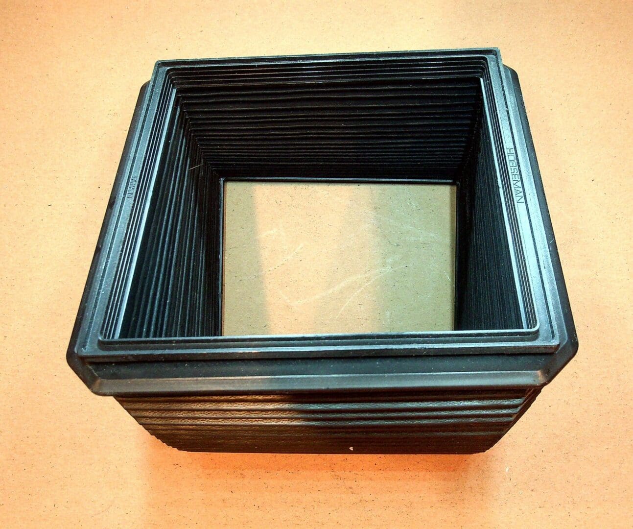 Square black ribbed rubber bellows
