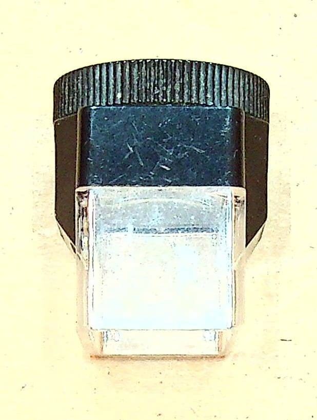 Small handheld magnifier with black top