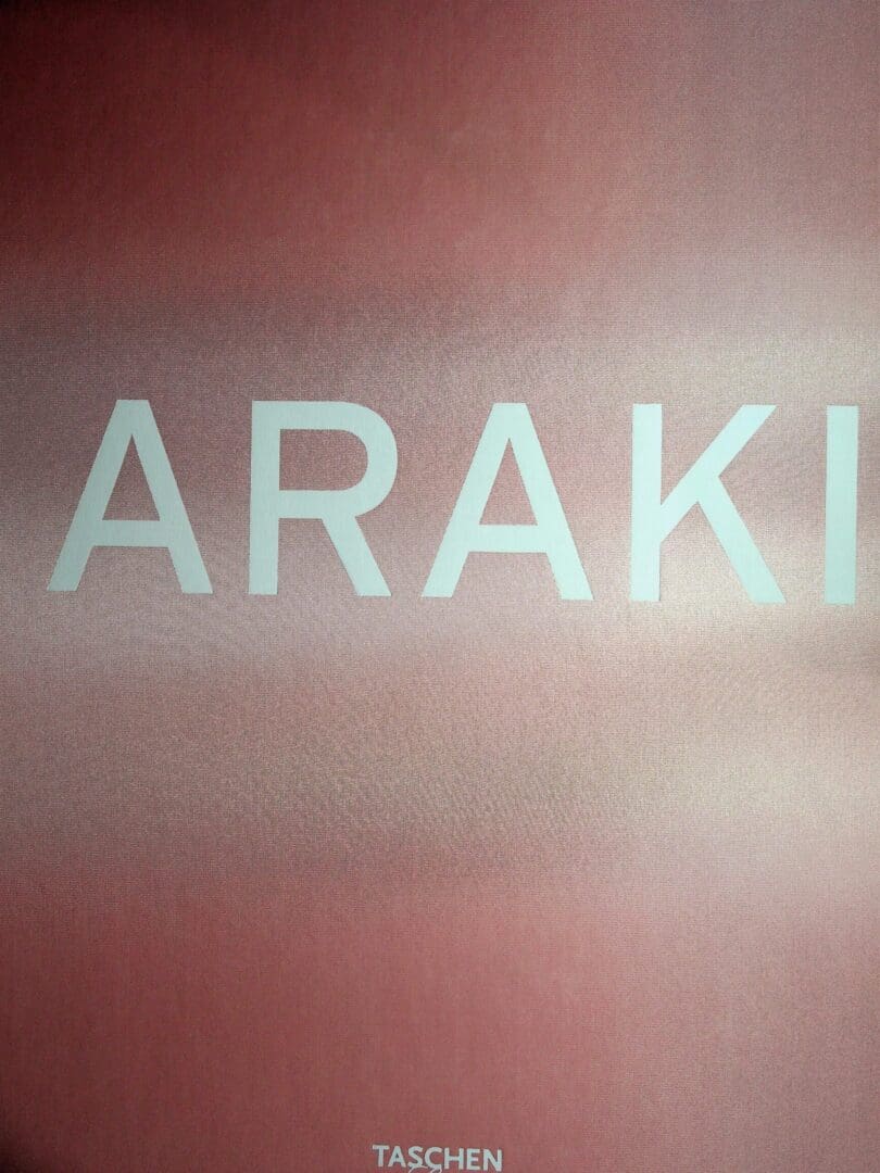 Pink textured book cover with ARAKI